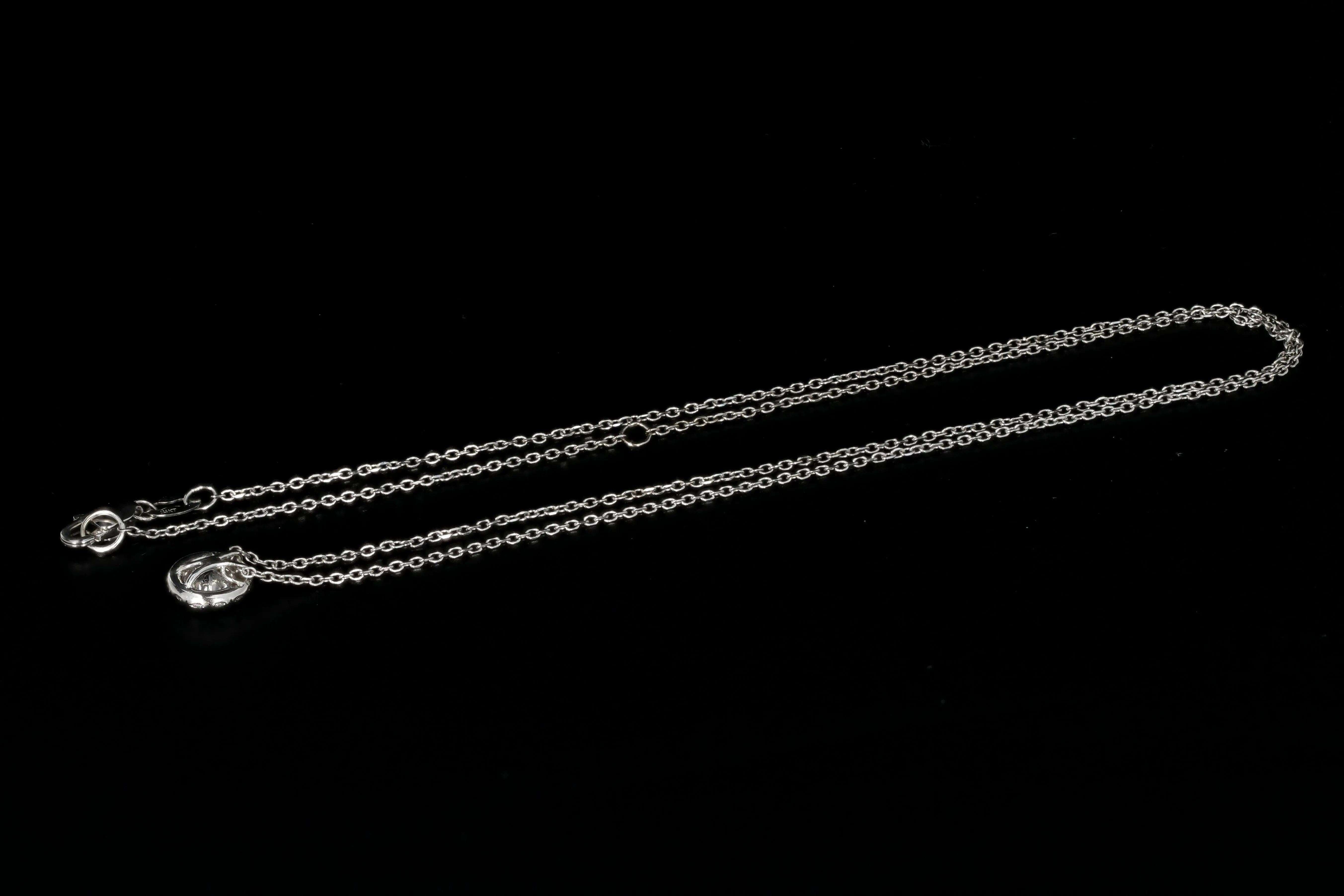 14K White Gold .50 Carat Diamond Halo Pendant Necklace