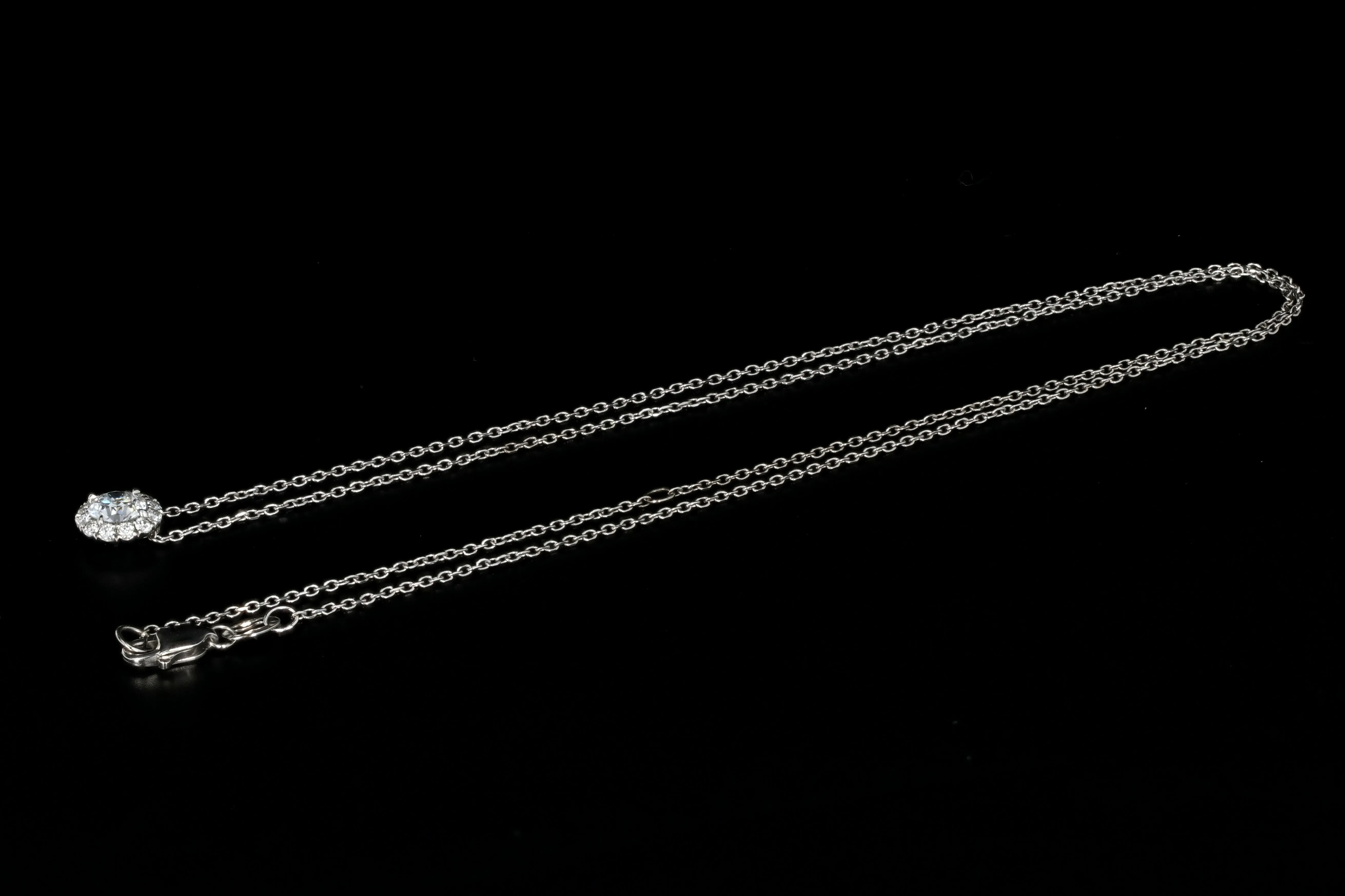 14K White Gold .50 Carat Diamond Halo Pendant Necklace