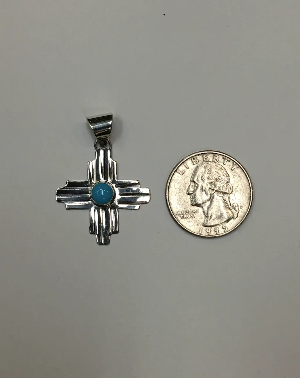 Sterling Silver Zia Pendant with Turquoise Accent, Medium Size