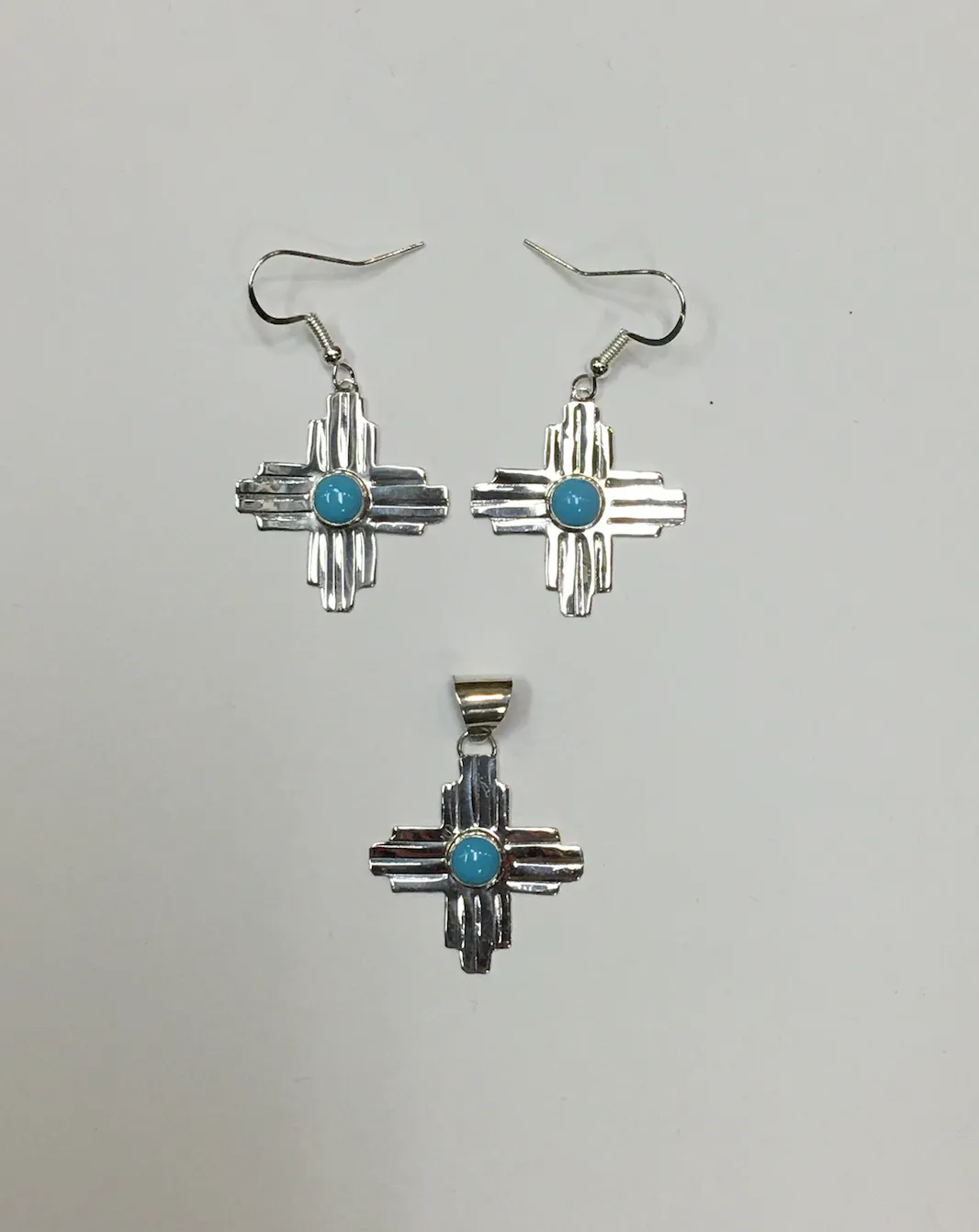 Sterling Silver Zia Pendant with Turquoise Accent, Medium Size